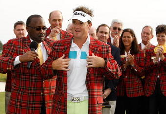 HILTON HEAD ISLAND, SC - APRIL 19:  Brian Gay puts on a jacket during the trophy presentation after the final round of the Verizon Heritage at Harbour Town Golf Links on April 19, 2009 in Hilton Head Island, South Carolina.  (Photo by Streeter Lecka/Getty Images)