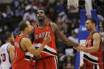 LOS ANGELES, CA - JANUARY 26: Greg Oden #52 of the Portland Trail Blazers celebrates with teammates Brandon Roy #7 and Jerryd Bayless #4 during their game against the Los Angeles Clippers at Staples Center January 26, 2009 in Los Angeles, California. NOTE TO USER: User expressly acknowledges and agrees that, by downloading and/or using this Photograph, user is consenting to the terms and conditions of the Getty Images License Agreement. (Photo by Kevork Djansezian/Getty Images)