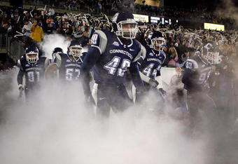 EAST HARTFORD, CT - NOVEMBER 3:  Members of the University of Connecticut Huskies run onto the field against the Rutgers Scarlet Knights at Rentschler Field November 3, 2007 in East Hartford, Connecticut.  (Photo by Jim Rogash/Getty Images)