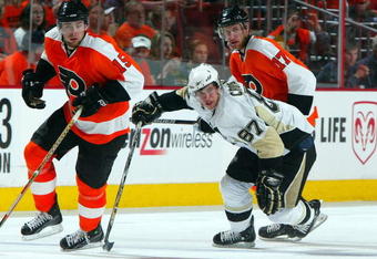 PHILADELPHIA - APRIL 25:  Sidney Crosby #87 of the Pittsburgh Penguins skates against Jeff Carter #17 and Joffrey Lupul #15 of the Philadelphia Flyers during Game Six of the Eastern Conference Quarterfinal Round of the 2009 NHL Stanley Cup Playoffs  at the Wachovia Center on April 25, 2009 in Philadelphia, Pennsylvania. The Penguins defeated the Flyers 5-3 to win the series 4 games to 2.  (Photo by Jim McIsaac/Getty Images)