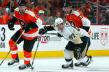 PHILADELPHIA - APRIL 25:  Sidney Crosby #87 of the Pittsburgh Penguins skates against Jeff Carter #17 and Joffrey Lupul #15 of the Philadelphia Flyers during Game Six of the Eastern Conference Quarterfinal Round of the 2009 NHL Stanley Cup Playoffs  at the Wachovia Center on April 25, 2009 in Philadelphia, Pennsylvania. The Penguins defeated the Flyers 5-3 to win the series 4 games to 2.  (Photo by Jim McIsaac/Getty Images)