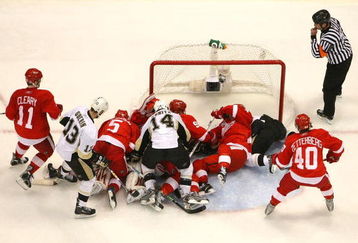 DETROIT - MAY 31:  The Pittsburgh Penguins fight for the puck in front of the goal against the Detroit Red Wings during Game Two of the 2009 Stanley Cup Finals at Joe Louis Arena on May 31, 2009 in Detroit, Michigan.  (Photo by Harry How/Getty Images)