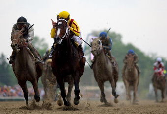 BALTIMORE - MAY 16:  Calvin Borel, riding Rachel Alexandra, crosses the finish line ahead of Mine That Bird to win the 134th Preakness Stakes at Pimlico Race Course on May 16, 2009 in Baltimore, Maryland.  (Photo by Matthew Stockman/Getty Images)