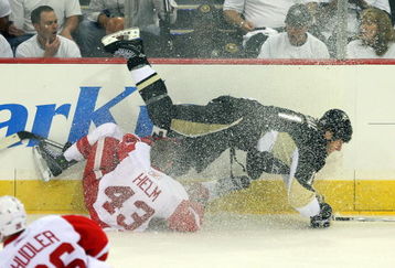 PITTSBURGH - JUNE 02:  Darren Helm #43 of the Detroit Red Wings trips up Jordan Staal #11 of the Pittsburgh Penguins during Game Three of the 2009 NHL Stanley Cup Finals on June 2, 2009 at Mellon Arena in Pittsburgh, Pennsylvania.  (Photo by Jim McIsaac/Getty Images)