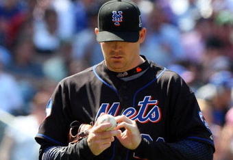 NEW YORK - MAY 13:  J.J. Putz #22 of the New York Mets looks on against the Atlanta Braves on May 13, 2009 at Citi Field in the Flushing neighborhood of the Queens borough of New York City. The Braves defeated the Mets 8-7 in twelve innings.  (Photo by Jim McIsaac/Getty Images)