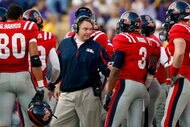 BATON ROUGE, LA - NOVEMBER 22:  Head coach Houston Nutt of the Ole Miss Rebels talks with his team during a timeout against the Louisiana State University Tigers on November 22, 2008 at Tiger Stadium in Baton Rouge, Louisiana.  (Photo by Chris Graythen/Getty Images)