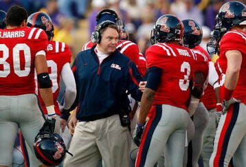BATON ROUGE, LA - NOVEMBER 22:  Head coach Houston Nutt of the Ole Miss Rebels talks with his team during a timeout against the Louisiana State University Tigers on November 22, 2008 at Tiger Stadium in Baton Rouge, Louisiana.  (Photo by Chris Graythen/Getty Images)