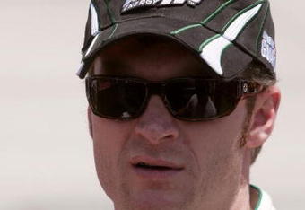 DOVER, DE - MAY 31:  Dale Earnhardt Jr., driver of the #88 AMP Energy/National Guard Chevrolet, stands on the grid prior to the start of the NASCAR Sprint Cup Series Autism Speaks 400 at Dover International Speedway on May 31, 2009 in Dover, Delaware.  (Photo by Jerry Markland/Getty Images for NASCAR)