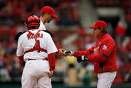 ST. LOUIS - APRIL 6:  Manager Tony La Russa takes the ball from pitcher Adam Wainwright #50 of the St. Louis Cardinals as catcher Yadier Molina looks on against the Pittsburgh Pirates during Opening Day on April 6, 2009 at Busch Stadium in St. Louis, Missouri.  The Pirates beat the Cardinals 6-4. (Photo by Dilip Vishwanat/Getty Images)  