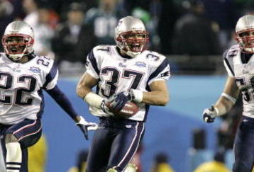 JACKSONVILLE, FL - FEBRUARY 6:   Rodney Harrison #37, Asante Samuel #22 and Mike Vrabel #50 of the New England Patriots celebrate after defeating the Philadelphia Eagles in Super Bowl XXXIX at Alltel Stadium on February 6, 2005 in Jacksonville, Florida.  The Patriots defeated the Eagles 24-21.  (Photo by Brian Bahr/Getty Images)
