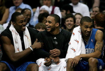 DENVER - JANUARY 17:  Dwight Howard #12, Jameer Nelson #14 and Courtney Lee #11 of the Orlando Magic share a laugh on the bench as they face the Denver Nuggets during NBA action at the Pepsi Center on January 17, 2009 in Denver, Colorado. The Magic defeated the Nuggets 106-88. NOTE TO USER: User expressly acknowledges and agrees that, by downloading and or using this Photograph, user is consenting to the terms and conditions of the Getty Images License Agreement.  (Photo by Doug Pensinger/Getty Images)