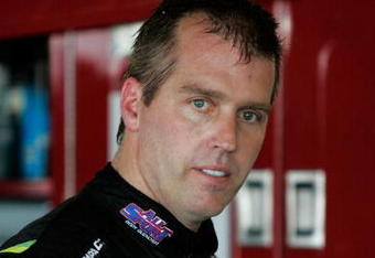TALLADEGA, AL - APRIL 24:  Jeremy Mayfield, driver of the #41 All Sport Body Quencher Toyota, waits in the garage area during practice for the NASCAR Sprint Cup Series Aaron's 499 at Talladega Superspeedway on April 24, 2009 in Talladega, Alabama.  (Photo by Jerry Markland/Getty Images for NASCAR)