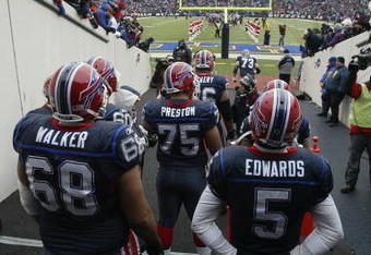 ORCHARD PARK, NY - DECEMBER 28:  Langston Walker #68, Duke Preston #75 and Trent Edwards #5 of the Buffalo Bills wait to walk on the field before the game against the New England Patriots on December 28, 2008 at Ralph Wilson Stadium in Orchard Park, New York. (Photo by Rick Stewart/Getty Images)