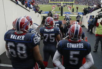 ORCHARD PARK, NY - DECEMBER 28:  Langston Walker #68, Duke Preston #75 and Trent Edwards #5 of the Buffalo Bills wait to walk on the field before the game against the New England Patriots on December 28, 2008 at Ralph Wilson Stadium in Orchard Park, New York. (Photo by Rick Stewart/Getty Images)