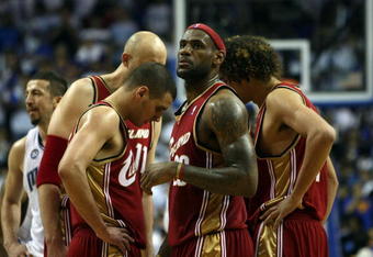 ORLANDO, FL - MAY 24:  LeBron James #23 of the Cleveland Cavaliers looks on while in a huddle with teammates while playing against the Orlando Magic in Game Three of the Eastern Conference Finals during the 2009 NBA Playoffs at the the Amway Arena on May 24, 2009 in Orlando, Florida. NOTE TO USER: User expressly acknowledges and agrees that, by downloading and or using this photograph, User is consenting to the terms and conditions of the Getty Images License Agreement.  (Photo by Elsa/Getty Images)