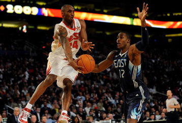 PHOENIX - FEBRUARY 15:  Kobe Bryant #24 of the Western Conference jumps up to pass around Dwight Howard #12 of the Eastern Conference during the 58th NBA All-Star Game, part of 2009 NBA All-Star Weekend at US Airways Center on February 15, 2009 in Phoenix, Arizona.  NOTE TO USER: User expressly acknowledges and agrees that, by downloading and or using this photograph, User is consenting to the terms and conditions of the Getty Images License Agreement.  (Photo by Ronald Martinez/Getty Images)