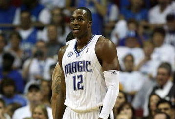 ORLANDO, FL - MAY 30: Dwight Howard #12 of the Orlando Magic looks on from the court against the Cleveland Cavaliers in Game Six of the Eastern Conference Finals during the 2009 Playoffs at Amway Arena on May 30, 2009 in Orlando, Florida. NOTE TO USER: User expressly acknowledges and agrees that, by downloading and or using this photograph, User is consenting to the terms and conditions of the Getty Images License Agreement  (Photo by Elsa/Getty Images)
