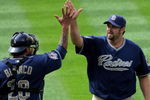 DENVER - MAY 31:  Relief pitcher Heath Bell #21 of the San Diego Padres celebrates with catcher Henry Blanco #28 after closing against the Colorado Rockies during MLB action at Coors Field on May 31, 2009 in Denver, Colorado. Bell earned the save as the Padres defeated the Rockies 5-2.  (Photo by Doug Pensinger/Getty Images)