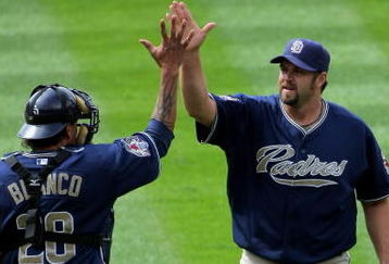 DENVER - MAY 31:  Relief pitcher Heath Bell #21 of the San Diego Padres celebrates with catcher Henry Blanco #28 after closing against the Colorado Rockies during MLB action at Coors Field on May 31, 2009 in Denver, Colorado. Bell earned the save as the Padres defeated the Rockies 5-2.  (Photo by Doug Pensinger/Getty Images)