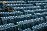FORT COLLINS, CO - NOVEMBER 01: A lone fan takes his seat as the Brigham Young Cougars and the Colorado State Rams take the field to warm up prior to the game at Sonny Lubick Field at Hughes Stadium on November 1, 2008 in Fort Collins, Colorado. BYU defeated CSU 45-42. (Photo by Doug Pensinger/Getty Images)