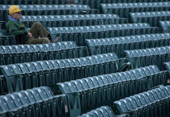 FORT COLLINS, CO - NOVEMBER 01:  A lone fan takes his seat as the Brigham Young Cougars and the Colorado State Rams take the field to warm up prior to the game at Sonny Lubick Field at Hughes Stadium on November 1, 2008 in Fort Collins, Colorado. BYU defeated CSU 45-42.  (Photo by Doug Pensinger/Getty Images)