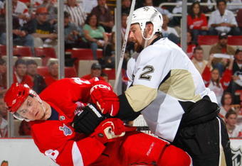 DETROIT - MAY 26:  Hal Gill #2 of the Pittsburgh Penguins collides into Jiri Hudler #26 of the Detroit Red Wings during game two of the 2008 NHL Stanley Cup Finals at Joe Louis Arena on May 26, 2008 in Detroit, Michigan.  (Photo by Dave Sandford/Getty Images)