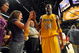 LOS ANGELES, CA - MAY 27: Kobe Bryant #24 of the Los Angeles Lakers gives a fan a five after defeating the Denver Nuggets 103-94 in Game Five of the Western Conference Finals during the 2009 NBA Playoffs at Staples Center on May 27, 2009 in Los Angeles, California. NOTE TO USER: User expressly acknowledges and agrees that, by downloading and or using this photograph, User is consenting to the terms and conditions of the Getty Images License Agreement. (Photo by Harry How/Getty Images)