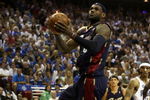 ORLANDO, FL - MAY 30: LeBron James #23 of the Cleveland Cavaliers drives to the hoop over Mickael Pietrus #20 of the Orlando Magic in Game Six of the Eastern Conference Finals during the 2009 Playoffs at Amway Arena on May 30, 2009 in Orlando, Florida. NOTE TO USER: User expressly acknowledges and agrees that, by downloading and or using this photograph, User is consenting to the terms and conditions of the Getty Images License Agreement  (Photo by Elsa/Getty Images)