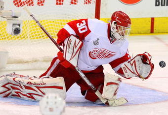 PITTSBURGH - JUNE 02:  Goaltender Chris Osgood #30 of the Detroit Red Wings saves a shot on goal by the Pittsburgh Penguins during Game Three of the 2009 NHL Stanley Cup Finals on June 2, 2009 at Mellon Arena in Pittsburgh, Pennsylvania.  (Photo by Jim McIsaac/Getty Images)