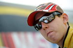 DOVER, DE - MAY 29:  Kyle Busch, driver of the #18 M&M's Toyota, stands in the garage area after qualifying for the NASCAR Sprint Cup Series Autism Speaks 400 at Dover International Speedway on May 29, 2009 in Dover, Delaware.  (Photo by Jeff Zelevansky/Getty Images for NASCAR)