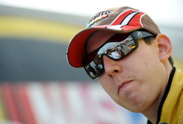 DOVER, DE - MAY 29:  Kyle Busch, driver of the #18 M&M's Toyota, stands in the garage area after qualifying for the NASCAR Sprint Cup Series Autism Speaks 400 at Dover International Speedway on May 29, 2009 in Dover, Delaware.  (Photo by Jeff Zelevansky/Getty Images for NASCAR)