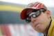 DOVER, DE - MAY 29: Kyle Busch, driver of the #18 M&M's Toyota, stands in the garage area after qualifying for the NASCAR Sprint Cup Series Autism Speaks 400 at Dover International Speedway on May 29, 2009 in Dover, Delaware. (Photo by Jeff Zelevansky/Getty Images for NASCAR)