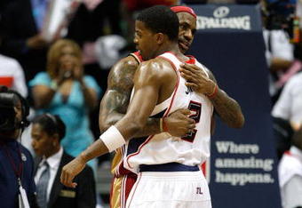ATLANTA - MAY 11:  LeBron James #23 of the Cleveland Cavaliers hugs Joe Johnson #2 of the Atlanta Hawks after the Cavaliers' 84-74 win in Game Four of the Eastern Conference Semifinals during the 2009 NBA Playoffs at Philips Arena on May 11, 2009 in Atlanta, Georgia.  NOTE TO USER: User expressly acknowledges and agrees that, by downloading and/or using this Photograph, user is consenting to the terms and conditions of the Getty Images License Agreement.  (Photo by Andy Lyons/Getty Images)