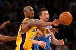 LOS ANGELES - JANUARY 16:  Kobe Bryant #24 of the Los Angeles Lakers makes a pass play during their NBA game against the Orlando Magic on January 16, 2009 at Staples Center in Los Angeles, California. The Magic won 109-103.   NOTE TO USER: User expressly acknowledges and agrees that, by downloading and/or using this Photograph, user is consenting to the terms and conditions of the Getty Images License Agreement. (Photo by Stephen Dunn/Getty Images)