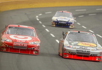 CONCORD, NC - MAY 25:  Juan Pablo Montoya, driver of the #42 Target Chevrolet, races Martin Truex Jr., driver of the #1 Bass Pro Shops/Tracker Boats Chevrolet, during the NASCAR Sprint Cup Series Coca-Cola 600 on May 25, 2009 at Lowe's Motor Speedway in Concord, North Carolina.  (Photo by Streeter Lecka/Getty Images)