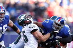 EAST RUTHERFORD, NJ - JANUARY 11:  Brandon Jacobs #27 of the New York Giants runs against Stewart Bradley #55 of the Philadelphia Eagles during the NFC Divisional Playoff Game on January 11, 2009 at Giants Stadium in East Rutherford, New Jersey.  (Photo by Al Bello/Getty Images)