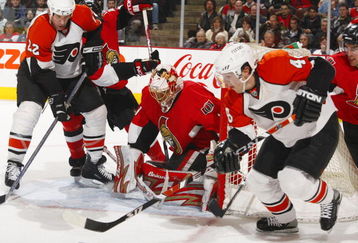 OTTAWA, CANADA- FEBRUARY 19:  Ray Emery #1 of the Ottawa Senators follows the play as Daniel Briere #48 of the Philadelphia Flyers comes out from behind the net with the puck while teammate Mike Knuble #22 battles for position at the top of the crease during a game on February 19, 2008 at the Scotiabank Place in Ottawa, Canada. The Ottawa Senators defeated the Philadelphia Flyers 3-2 in a shootout. (Photo by Phillip MacCallum/Getty Images)