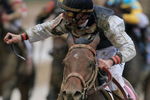 LOUISVILLE, KY - MAY 02:  Jockey Calvin Borel atop Mine That Bird crosses the finish line to win the 135th running of the Kentucky Derby on May 2, 2009 at Churchill Downs in Louisville, Kentucky.  (Photo by Matthew Stockman/Getty Images)
