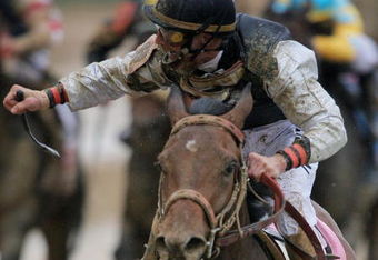 LOUISVILLE, KY - MAY 02:  Jockey Calvin Borel atop Mine That Bird crosses the finish line to win the 135th running of the Kentucky Derby on May 2, 2009 at Churchill Downs in Louisville, Kentucky.  (Photo by Matthew Stockman/Getty Images)