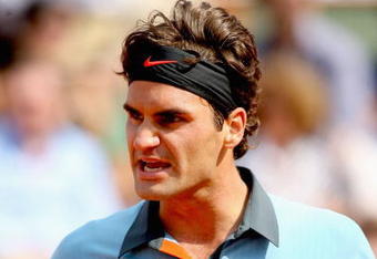 PARIS - JUNE 03:  Roger Federer of Switzerland celebrates victory during the Men's Singles Quarter Final match against Gael Monfils of France on day eleven of the French Open at Roland Garros on June 3, 2009 in Paris, France.  (Photo by Matthew Stockman/Getty Images)