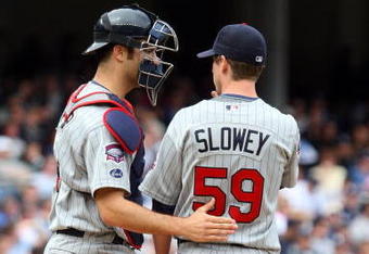 NEW YORK - MAY 17:  Joe Mauer #7 of the Minnesota Twins talks with teammate Kevin Slowey #59 against the New York Yankees on May 17, 2009 at Yankee Stadium in the Bronx borough of New York City. The Yankees defeated the Twins 3-2 in ten innings.  (Photo by Jim McIsaac/Getty Images)