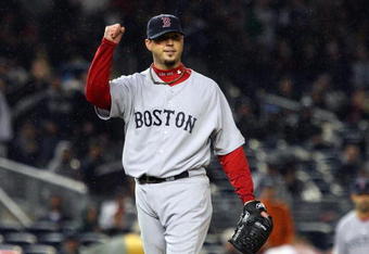 NEW YORK - MAY 05:  Josh Beckett #19 of the Boston Red Sox celebrates the final out of the sixth inning against the New York Yankees on May 5, 2009 at Yankee Stadium in the Bronx borough of New York City. The Red Sox defeated the Yankees 7-3.  (Photo by Jim McIsaac/Getty Images)