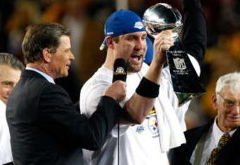 TAMPA, FL - FEBRUARY 01:  Santonio Holmes #10, Ben Roethlisberger #7 and team owner Dan Rooney of the Pittsburgh Steelers celebrate with the Vince Lonbardi trophy after the defeated the Arizona Cardinals 27-23 during Super Bowl XLIII on February 1, 2009 at Raymond James Stadium in Tampa, Florida.  (Photo by Win McNamee/Getty Images)