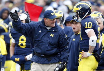 ANN ARBOR, MI - OCTOBER 25: Head coach Rich Rodriguez of the Michigan Wolverines talks with Steven Threet #10 while playing the Michigan State Spartans on October 25, 2008 at Michigan Stadium in Ann Arbor, Michigan.  (Photo by Gregory Shamus/Getty Images)