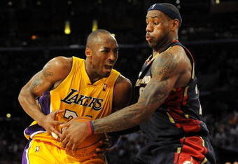 LOS ANGELES, CA - JANUARY 19:  LeBron James #23 of the Cleveland Cavaliers attempts to steal the ball from Kobe Bryant #24 of the Los Angeles Lakers during the forth quarter at Staples Center on January 19, 2009 in Los Angeles, California.  (Photo by Harry How/Getty Images)