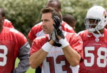 TEMPE, AZ - MAY 2 :  Kurt Warner #13 of the Arizona Cardinals is presented with his 2009 Pro Bowl jersey during a team minicamp at the team training facility on May 2, 2009 in Tempe, Arizona.  (Photo by Jonathan Willey/Getty Images)