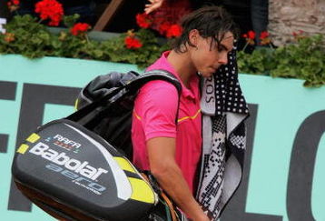 PARIS - MAY 31:  Defeated champion Rafael Nadal of Spain walks off court following his defeat during the Men's Singles Fourth Round match against Robin Soderling of Sweden on day eight of the French Open at Roland Garros on May 31, 2009 in Paris, France.  (Photo by Matthew Stockman/Getty Images)