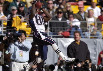 27 Jan 2002:  David Patten #86 of the New England Patriots catches a pass in the endzone to give the Patriots a 14-3 lead during the first half of the AFC  Championship Game between the Pittsburgh Steelers and the New England Patriots at Heinz Field in Pittsburgh, Pennsylvania.  Digital Image Mandatory Credit: Ezra Shaw/Getty Images