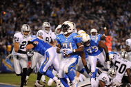SAN DIEGO - DECEMBER 04:  Running Back LaDainian Tomlinson #21 of the San Diego Chargers rushes for the first touchdown of the game against the Oakland Raiders during their NFL Game on December 4, 2008 at Qualcomm Stadium in San Diego, California.  (Photo by Harry How/Getty Images)