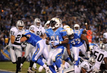 SAN DIEGO - DECEMBER 04:  Running Back LaDainian Tomlinson #21 of the San Diego Chargers rushes for the first touchdown of the game against the Oakland Raiders during their NFL Game on December 4, 2008 at Qualcomm Stadium in San Diego, California.  (Photo by Harry How/Getty Images)